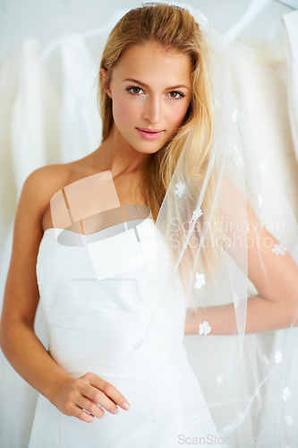 Image of Wedding, portrait and young bride in a dress in a luxury boutique, shop or store in a mall. Retail, romance and female person from Canada preparing for marriage ceremony, party or reception for love.