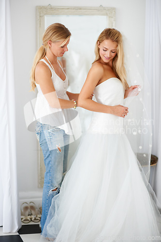 Image of Wedding, dress and bride with girl friend in a luxury boutique, shop or store in a mall. Retail, romance and female person from Canada preparing for marriage ceremony, party or reception for love.