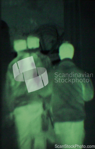 Image of Military, people and green night vision, walking or dark silhouette of spy, agent or terrorist with soldier. Police, surveillance or men training in infrared scope for army or security mission