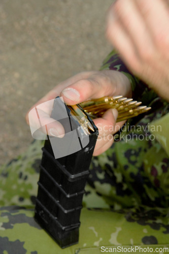 Image of Rifle, soldier hands and bullet for gun outdoor with military training, battle and conflict. Army, war and field with a male tactical expert of a hero with weapon for shooting range and warrior gear