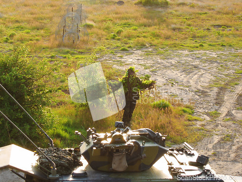 Image of Sniper gun, camouflage and person aim, target or focus shooting at soldier, tactical mission training in nature. Battlefield, rifle gear and army shooter, warrior and military battle transportation.