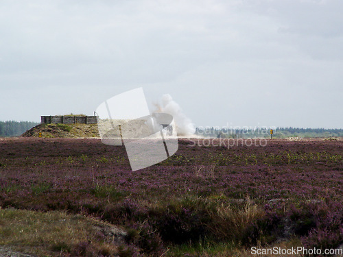 Image of War, explosion and missile attack in the countryside during conflict or fighting for freedom with space. Sky, mockup and bomb with a cloud of smoke outdoor on a military warzone or battlefield