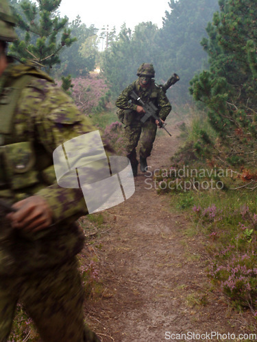 Image of Soldier, rifle and running in forest with camouflage for secret mission, scout or outdoor intel. Army man on route or move with gun, firearm or uniform for USA military operation, terrorist or attack