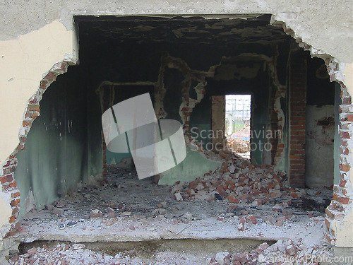 Image of Building, warzone and destruction of a home during military conflict or turmoil during battle. Hole, damage and wall of a housing structure on a battlefield in Israel or Palestine during war