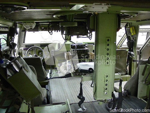 Image of Military, army and interior of vehicle or transport for mission, training or battle with equipment or background. Transportation, van and inside for service, navigation or operation with armed forces