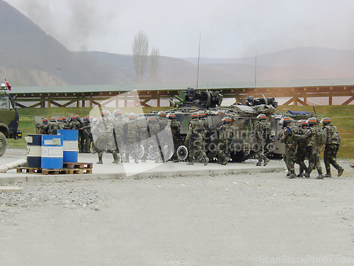 Image of Military, army and soldier team or back together for mission, order or operation on battlefield or outdoor. Teamwork, squad and bootcamp with camouflage, weapons and vehicles or transport for battle