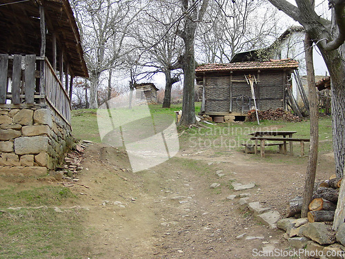 Image of Farm, forest and a wood cabin on a path in Kosovo during 1999 after conflict during war or battle. Agriculture, sustainability and village with a house or barn in the woods on a nature landscape