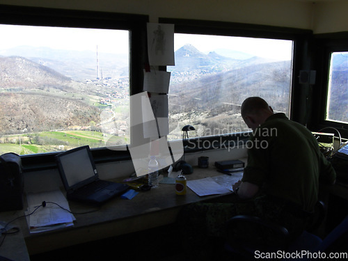 Image of Radio tower, air traffic control and a man at his desk to monitor the airways with a view of the sky. Airport, aviation and navigation with a person working on flight strategy or direction of travel