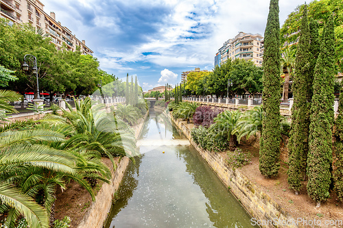 Image of Canal Torrent de Sa Riera in street Passeig de Mallorca. Mallorc