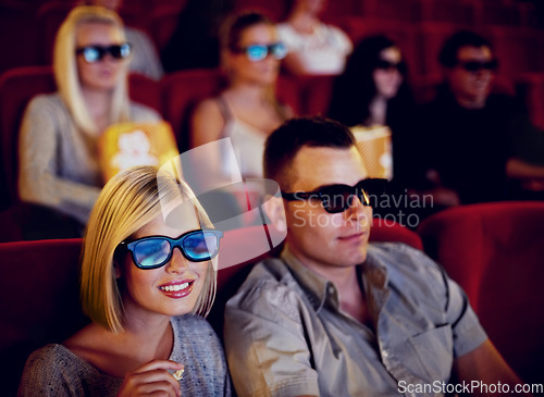 Image of Cinema, 3d glasses and couple watching film, eating popcorn and romantic date together. Movie night, man and woman with smile in theater, snacks and eyewear, sitting in auditorium to relax at show.