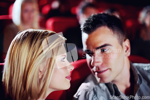 Image of Cinema, romance and couple watching film, love and romantic date together. Movie night, man and woman in theater with smile, attraction and sitting in auditorium to relax at show with happiness.