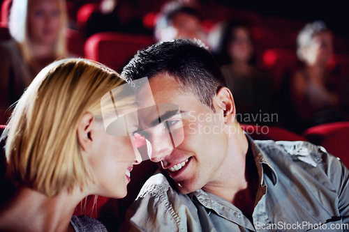 Image of Cinema, date and happy couple watching movie, smile and romantic night together for show. Theater, man and woman with love, trust and care sitting in auditorium audience to relax at film premier