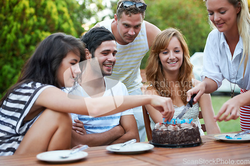 Image of Birthday, friends and cutting cake outdoor for celebration, surprise or party with milestone or happiness. Dessert, men and women in backyard of home with gathering or social event with smile and fun