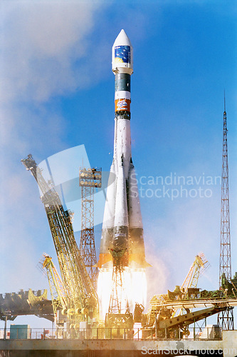 Image of Rocket launch into sky, travel and space mission for research, exploration and discovery in cosmos. Science, aerospace innovation or technology, spaceship in flight at ground site with flame and fuel