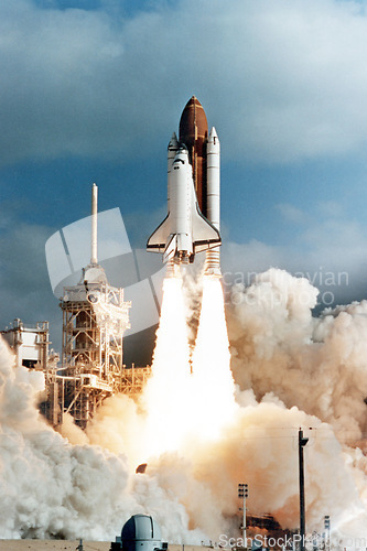 Image of Spaceship launch, dust cloud and travel on space mission in research, exploration or discovery in cosmos. Science, aerospace innovation or technology for rocket in flight with flame, power and energy