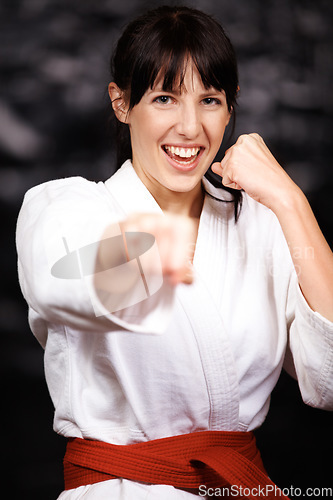 Image of Woman, karate and punch in portrait, fight and self defense sport with muay thai and training. Athlete, combat and power with fitness, martial arts and energy with warrior, exercise and taekwondo
