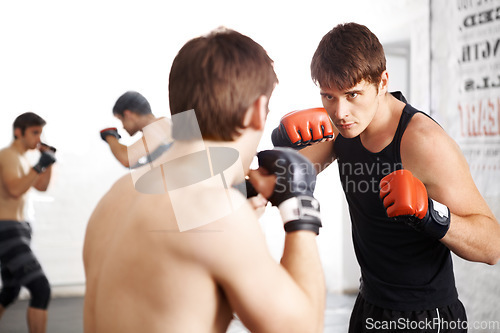 Image of Man, fighting and martial arts training for self defense techniques with sparring partner at dojo. Male person, athlete or fighter in kick boxing, karate or MMA for jujitsu match, sports or face off