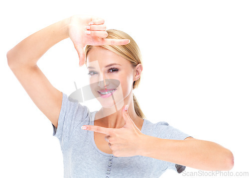 Image of Portrait, woman and finger frame in studio to review creative profile picture on white background. Happy model check perspective for photography ideas, planning selfie and hand sign to border face