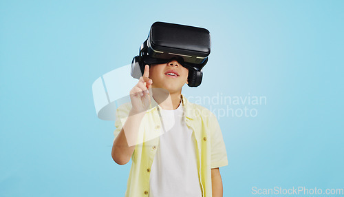 Image of VR, child and glasses with video gaming, technology and metaverse online in studio. Young boy, gamer and augmented reality app for streaming and virtual graphic on internet with blue background
