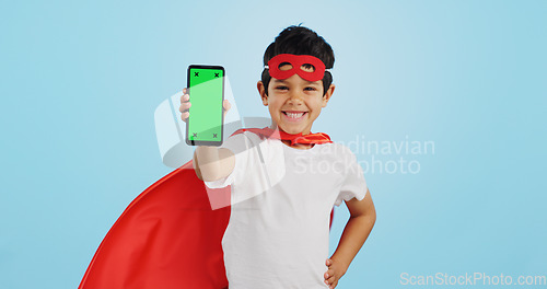 Image of Child, game and portrait with phone green screen for superhero, justice or happy mockup with ux tracking markers. Kid, super hero and smartphone with mock up space and vigilante, costume and games