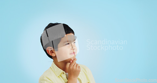Image of Thinking, inspiration and ideas, confused youth boy in studio with future or solution on blue background. Why, question with problem solving and remember, mockup space with kid insight and memory or