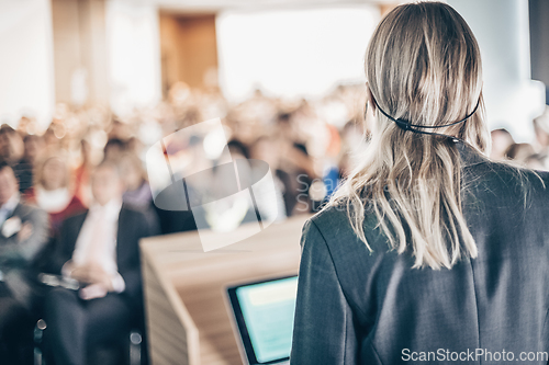 Image of Speaker at Business Conference and Presentation.