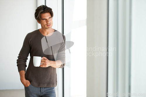 Image of Coffee, thinking and young man at apartment with memory, vision or reflection face expression. Handsome, morning and male person from Canada with latte, cappuccino or espresso with an idea at home.