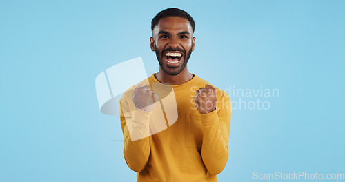 Image of Wow, news and happy man in studio with winner, fist or celebration, dance or victory on blue background. Surprise, success or portrait of guy winner with energetic reaction to prize, giveaway or deal