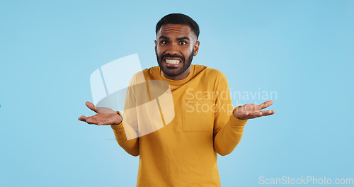 Image of Confused, hands and face of man in studio with dont know, gesture or ask on blue background. Why, portrait and guy model with oops, mistake or doubt, unsure or forget, guess or palm scale questions