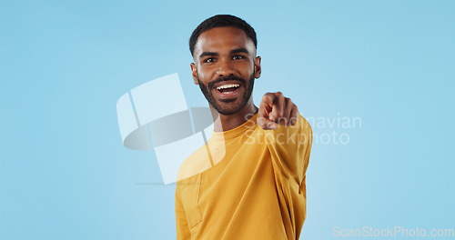Image of Face and man with hand pointing at you in studio with choice, selection or offer on blue background. Opportunity, offer and portrait of male model with emoji for join us, deal or invitation