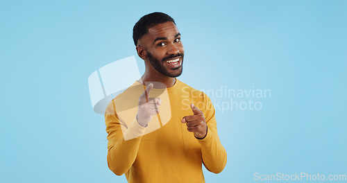 Image of Face, excited and black man pointing at you for decision, choice or selection in studio isolated on a blue background mockup space. Portrait, hand gesture and person hiring, recruitment or invitation