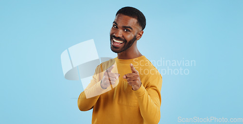 Image of Face, excited and black man pointing at you for decision, choice or selection in studio isolated on a blue background mockup space. Portrait, hand gesture and person hiring, recruitment or invitation