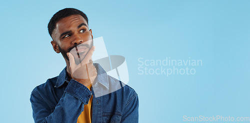 Image of Man, thinking and planning idea with choice and decision in studio on blue background and questions. Brainstorming, person and problem solving ideas or why with solution and remember on mock up space