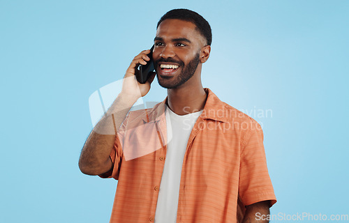 Image of Phone call, funny and black man talking, conversation and joke in studio isolated on a blue background mockup space. Smartphone, laughing and happy African person in communication, meme and comedy