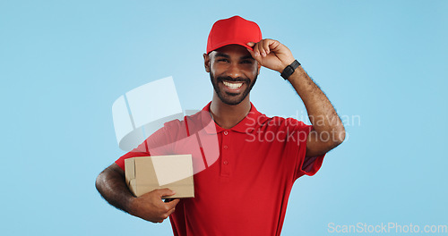 Image of Happy man, box and delivery in transport service, package or order in studio against a blue background. Portrait of male person or courier guy smile with parcel, cargo or logistics on mockup space