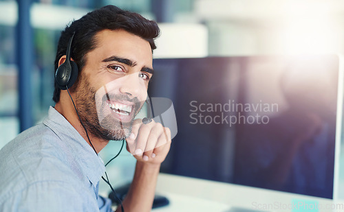 Image of Portrait, telemarketing and man with a computer, call center and lens flare with headphones, crm and tech support. Face, office or agent with a headset, customer service and help desk with consultant