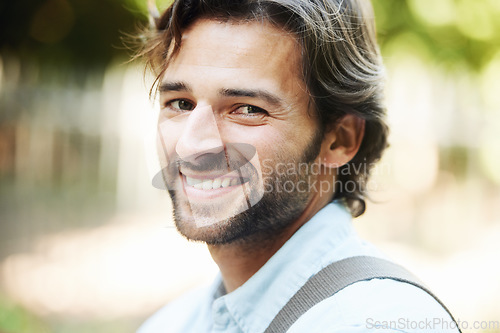 Image of Portrait, smile or happy man in park for travel in summer for holiday vacation or break in garden. Confident tourist, wellness or face of person in nature resting in a natural environment to relax