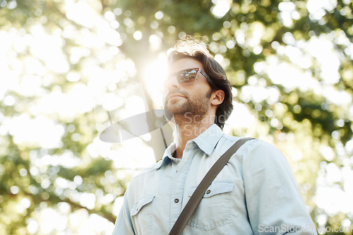 Image of Relax, sunglasses or man in park walking in summer for fresh air, holiday vacation or break in garden in Italy. Tourism, thinking or male person in nature or natural environment for travel