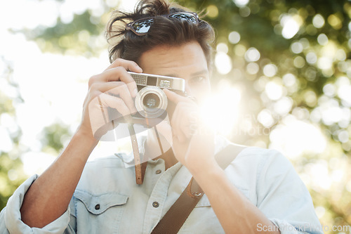 Image of Camera, photography or man shooting in park on holiday vacation trip for creativity or tourism memory. Photographer, travel or male tourist with pictures for sightseeing or trees in nature in summer
