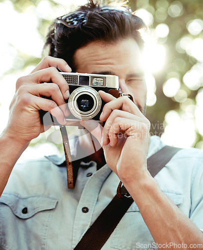 Image of Camera, photography or man in nature on holiday vacation trip for creativity, shooting or tourism memory. Photographer, travel or male tourist with pictures for sightseeing or trees in park in summer
