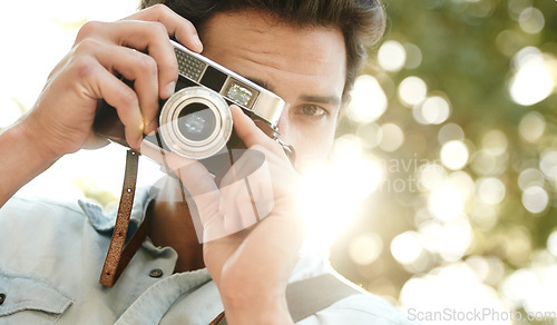 Image of Camera, photography or face of man in park on holiday vacation trip for creativity, shooting or tourism memory. Photographer, travel or male tourist with pictures for sightseeing in nature in summer