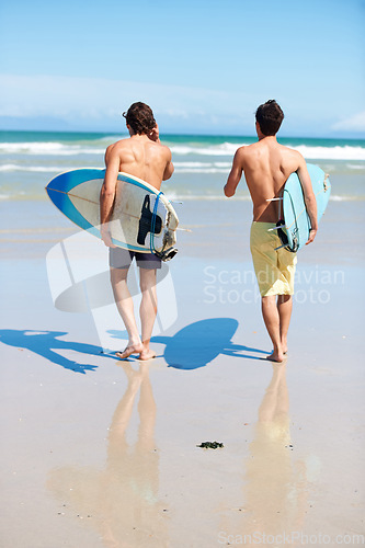Image of Running, surfing and rear view of men friends at a beach with freedom, energy or fun. Back, fitness and surfer people at the ocean excited for summer vacation, workout or water sports hobby in Hawaii