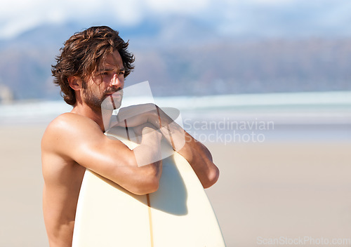 Image of Surfing, fitness and man thinking at a beach with surfboard for training, freedom or fun. Relax, adventure and male surfer at the sea for water sports, travel or vacation, holiday or summer hobby