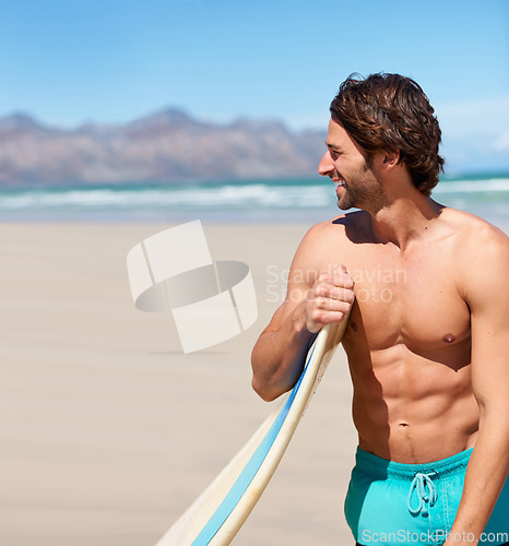 Image of Surfing, fitness and happy man at a beach with surfboard for training, hobby or fun in nature. Water, sports and male surfer relax at the sea for travel, freedom and adventure workout in Hawaii