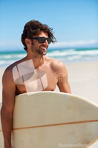 Image of Happy man, surf and vacation with sunglasses by the beach and sea for fitness and water sport with mockup space. Confidence, male person and surfboard for workout and training by ocean with freedom