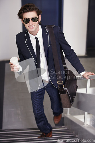 Image of Happy, businessman and walking on stairs with coffee cup in office, fashion or graduate internship in real estate. Realtor, intern and excited for work in corporate job, workplace or drink on break