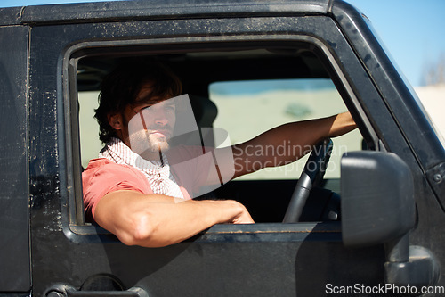 Image of Man, car and driving for road trip, travel or holiday in outdoor journey or adventure in nature. Handsome or attractive male person or driver looking out window of vehicle in traveling, view or break