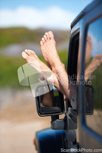 Image of Car window, feet and person on outdoor journey, easy adventure or motor transport on travel vacation, holiday or road trip. Automobile, relax legs and foot of driver driving in suv, van or vehicle