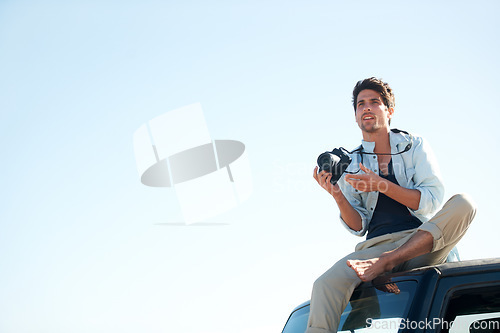 Image of Man, photographer or camera on car outdoor for road trip, adventure or journey on rooftop with travel. Person, photography or memories for vacation, holiday or scenery in Asia or sky mockup in nature