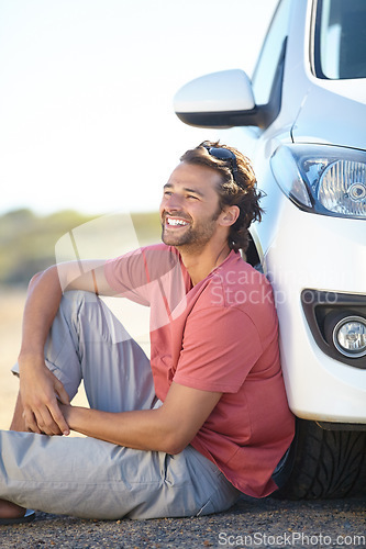 Image of Car road trip, ground and happy man relax, sitting and smile for journey, adventure or motor transportation in Australia. Automobile, SUV vehicle and person smile, rest and break on outdoor dirt road